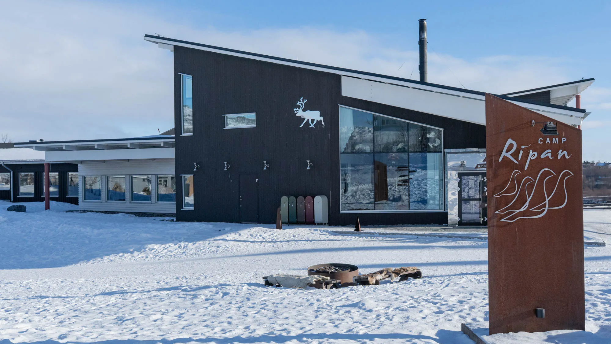photo of a modern building with sign outside, reading "camp ripan"