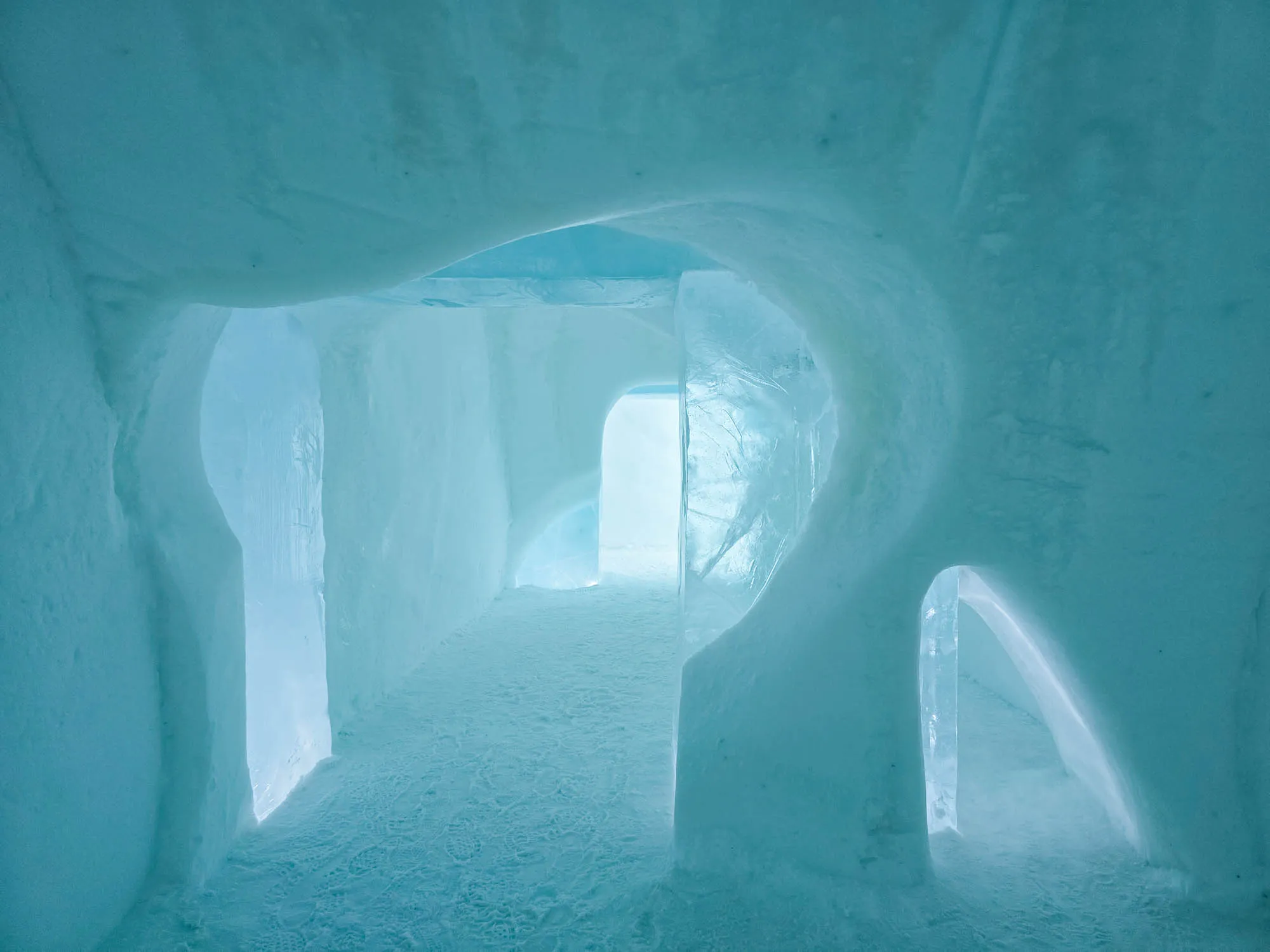 shot down a hallway, parts of the walls are clear ice, others solid