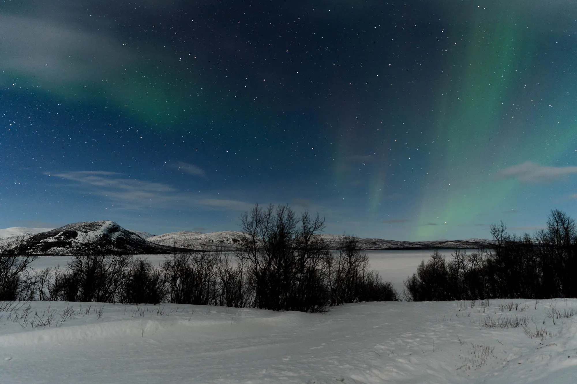 hints of aurora above mountain range