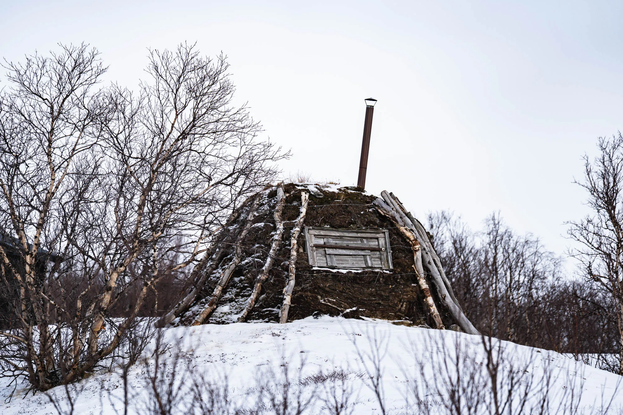 traditional sami hut in the snow