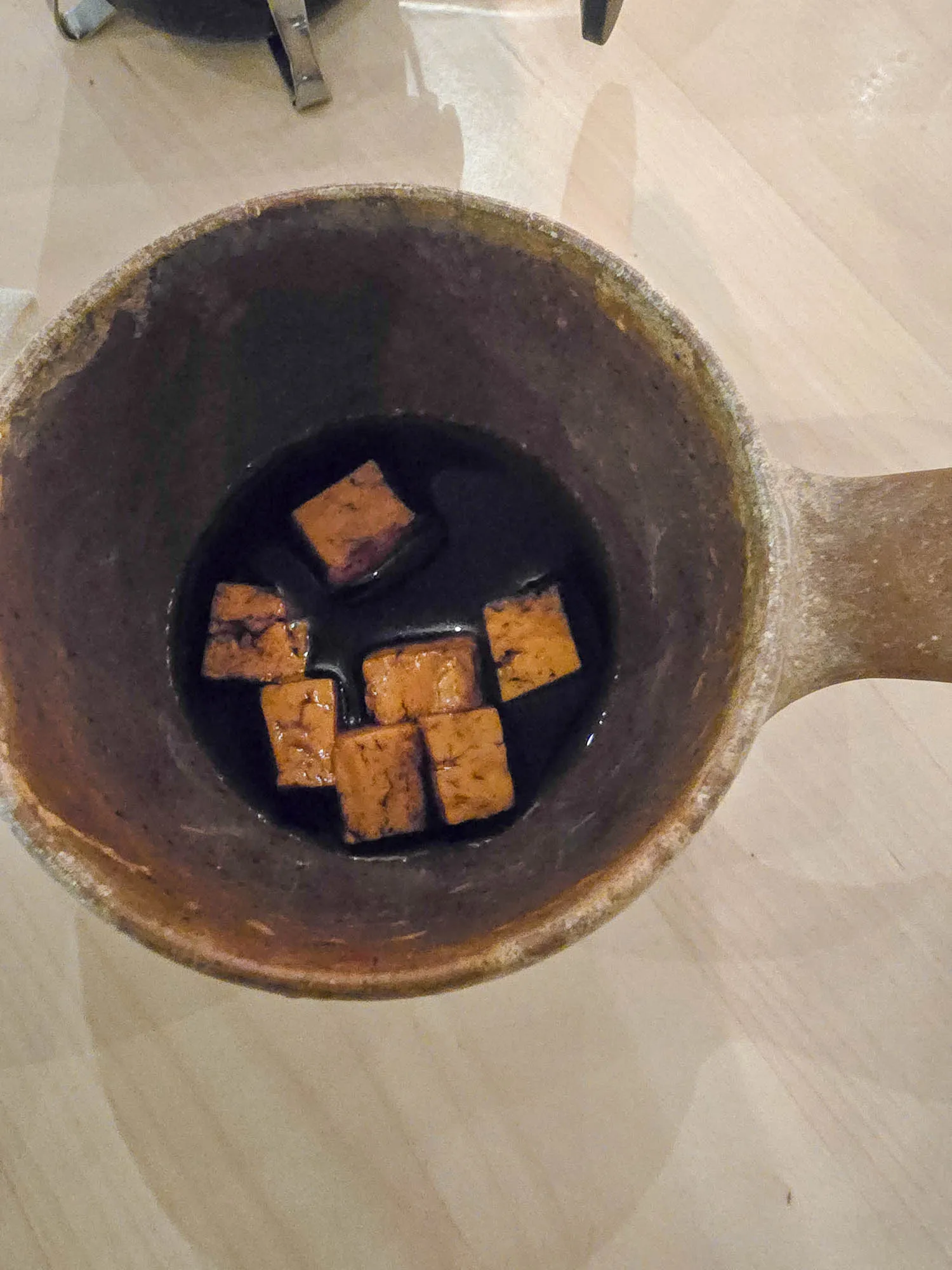 soaked bread cheese at the bottom of the guksi cup