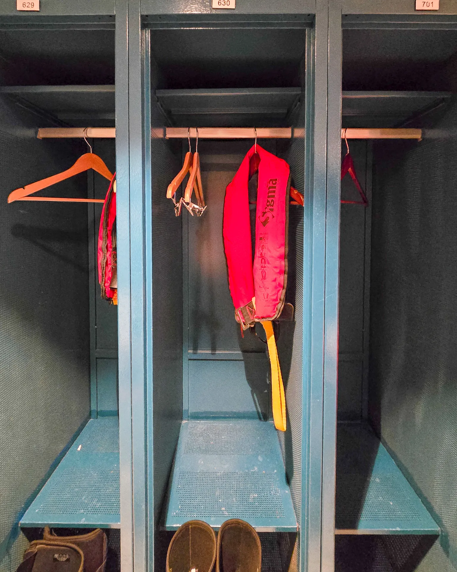 shot of mud room cubby, life jacket hanging and waterproof boots