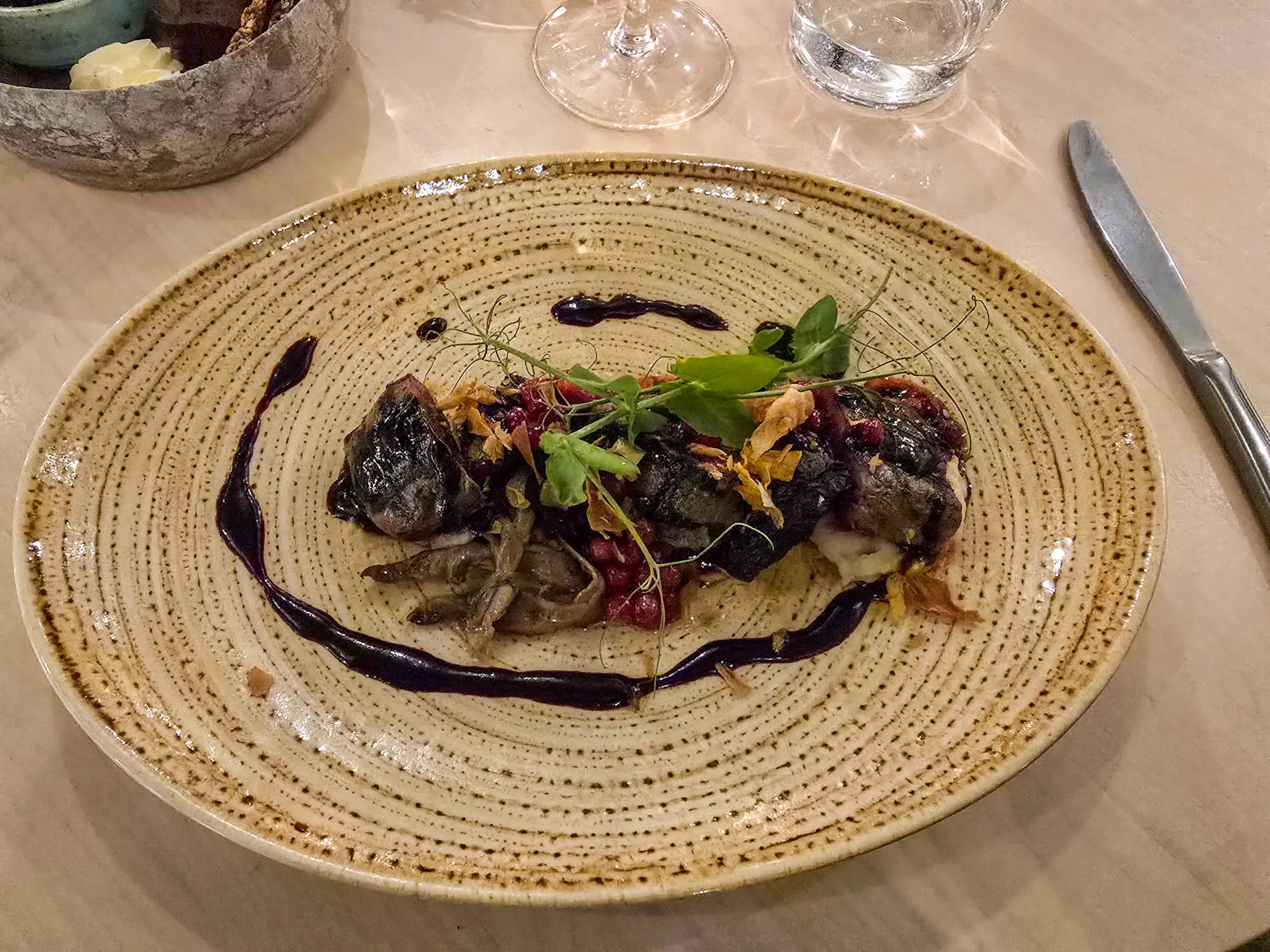 a plate of food in dark restaurnt