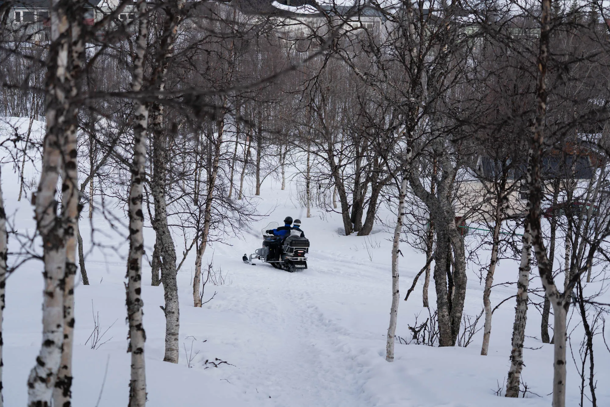 two people on a snow mobile