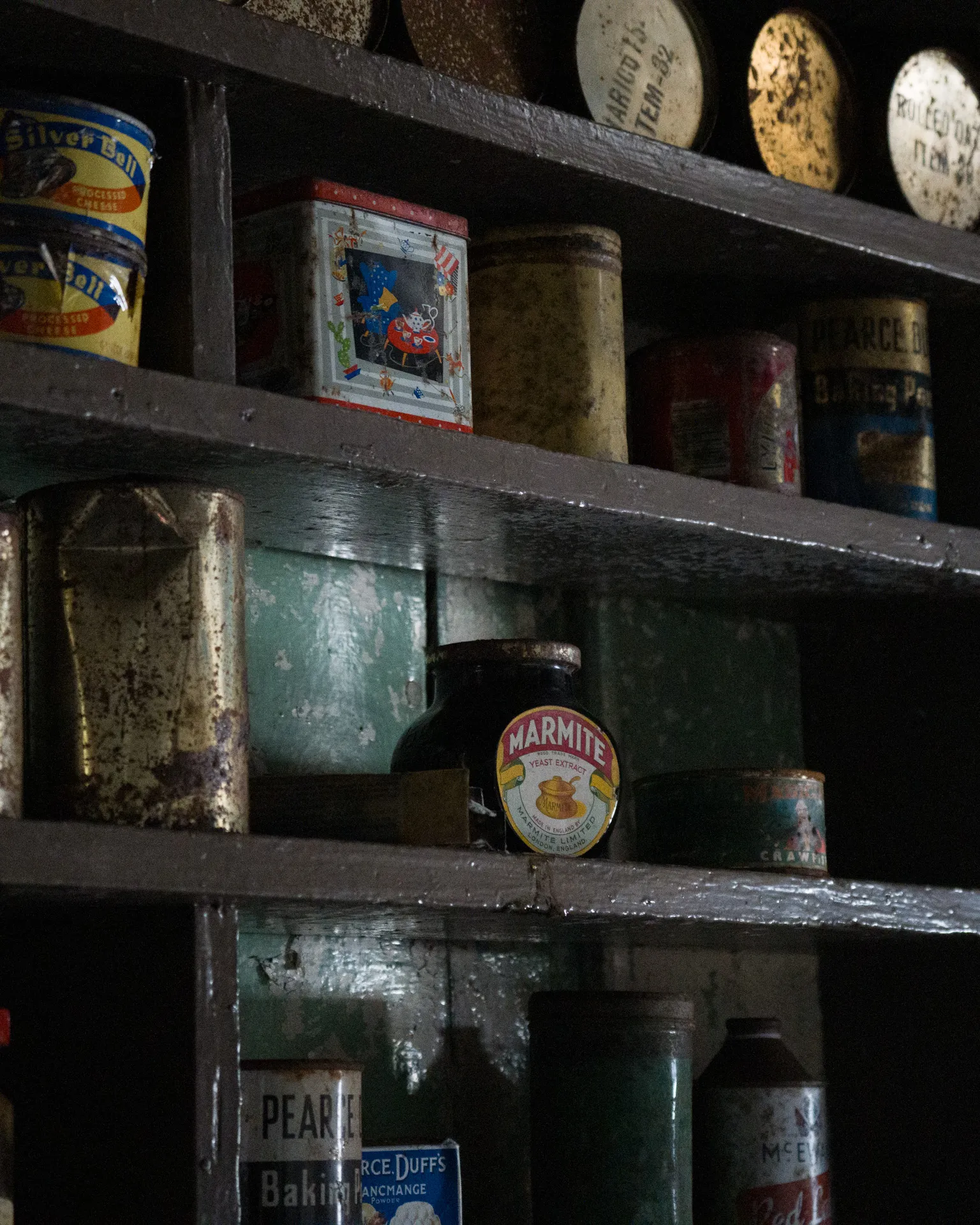 a glass of marmite on a shelf